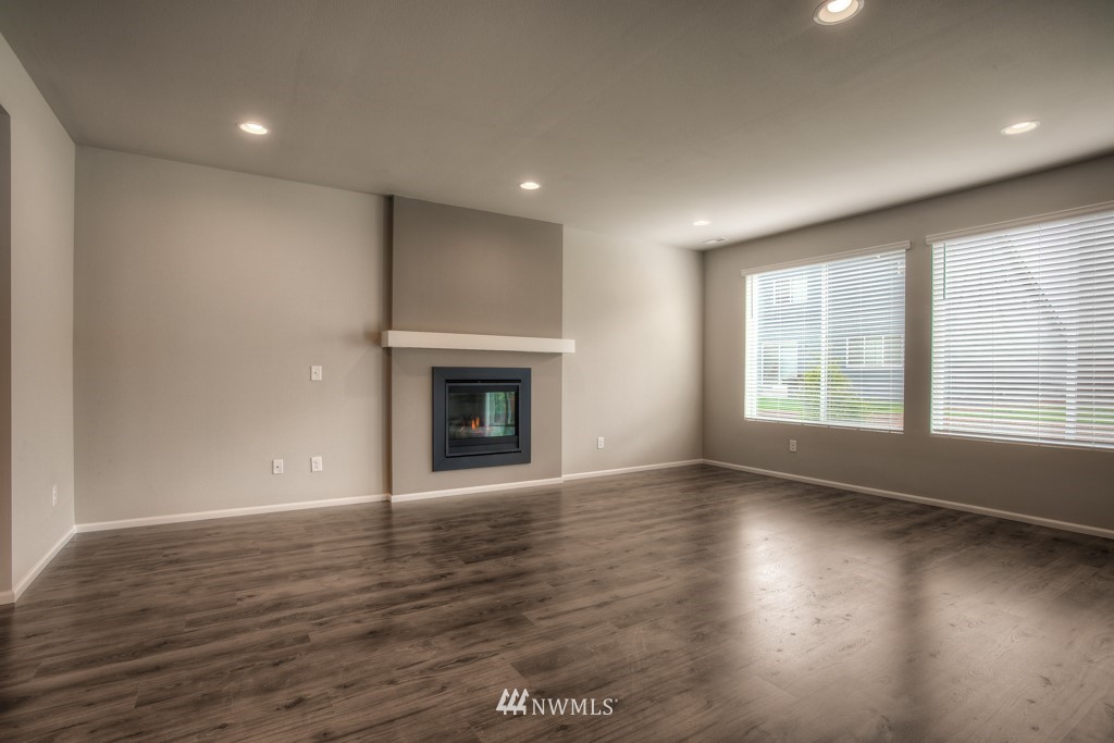 21127 Meridian Drive Southeast, Unit P23 Bothell, WA 98021 - Photo 31 of 40 a view of an empty room with wooden floor and a window
