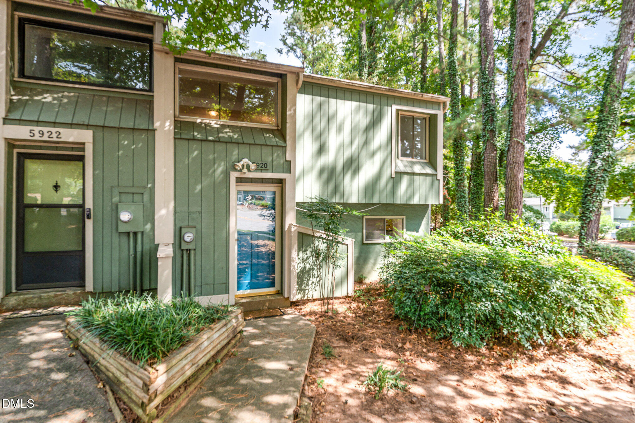 5920 Farm Gate Road Raleigh, NC 27606 - Photo 1 of 17 a front view of a house with garden