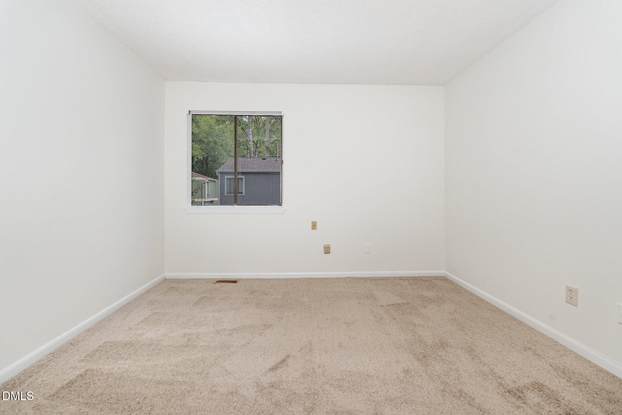 5920 Farm Gate Road Raleigh, NC 27606 - Photo 11 of 17 an empty room with a window