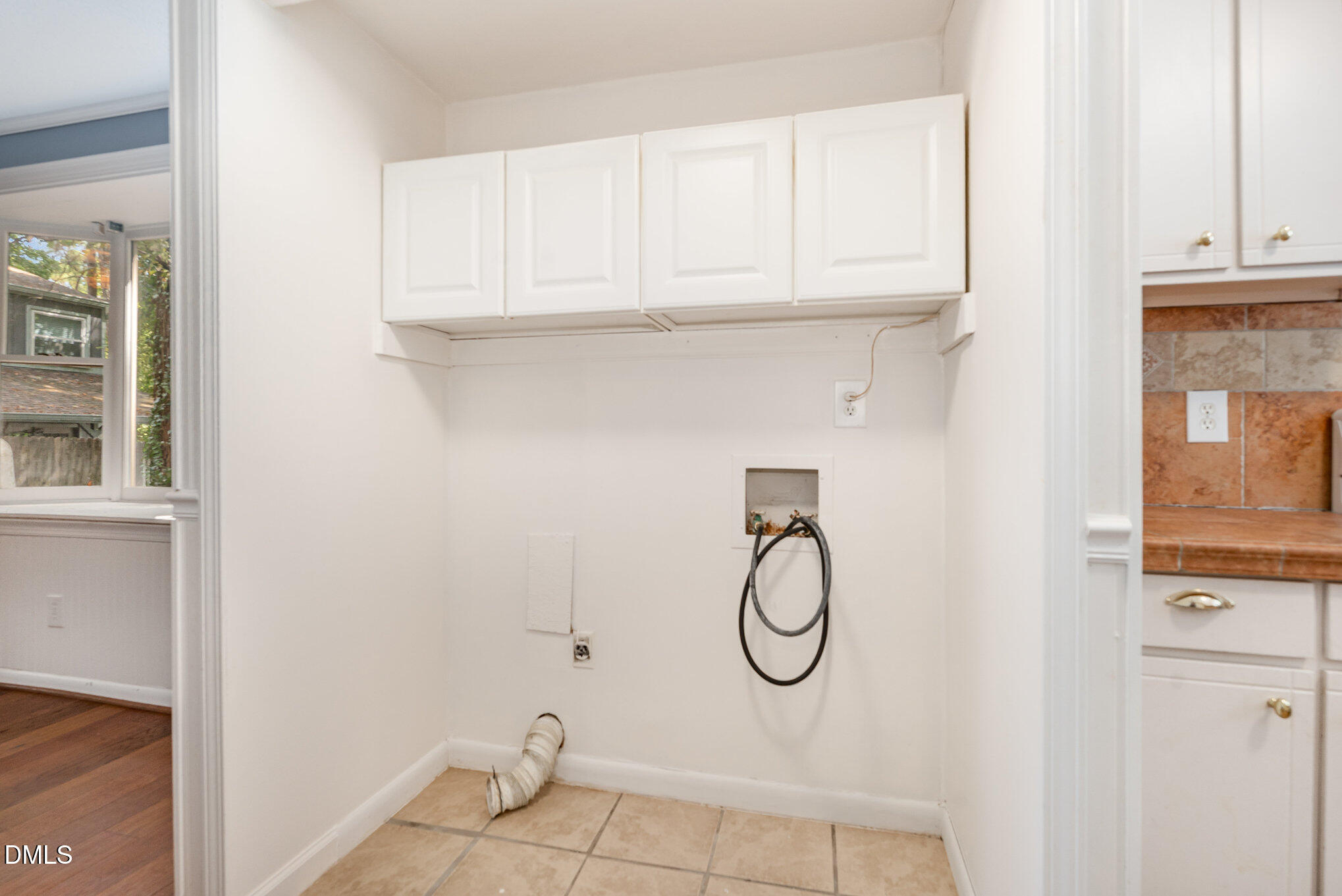 5920 Farm Gate Road Raleigh, NC 27606 - Photo 16 of 17 a bathroom with a sink and cabinets