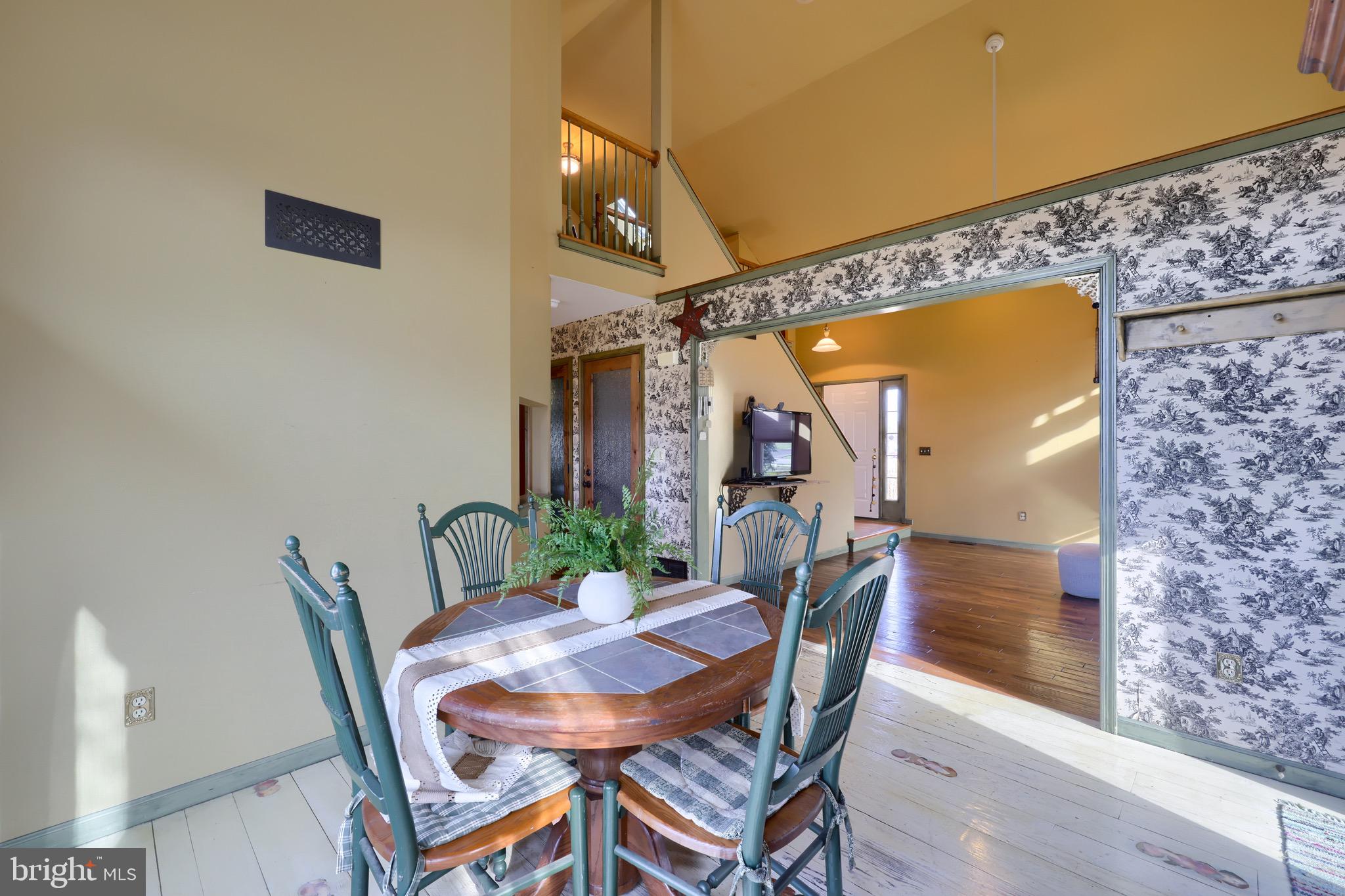 65 South Reamstown Road Stevens, PA 17578 - Photo 14 of 55 a view of a dining room with furniture and wooden floor