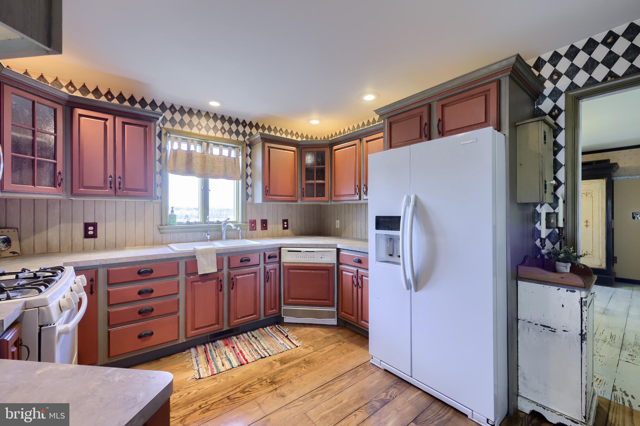 65 South Reamstown Road Stevens, PA 17578 - Photo 16 of 55 a kitchen with stainless steel appliances granite countertop a refrigerator and a stove top oven