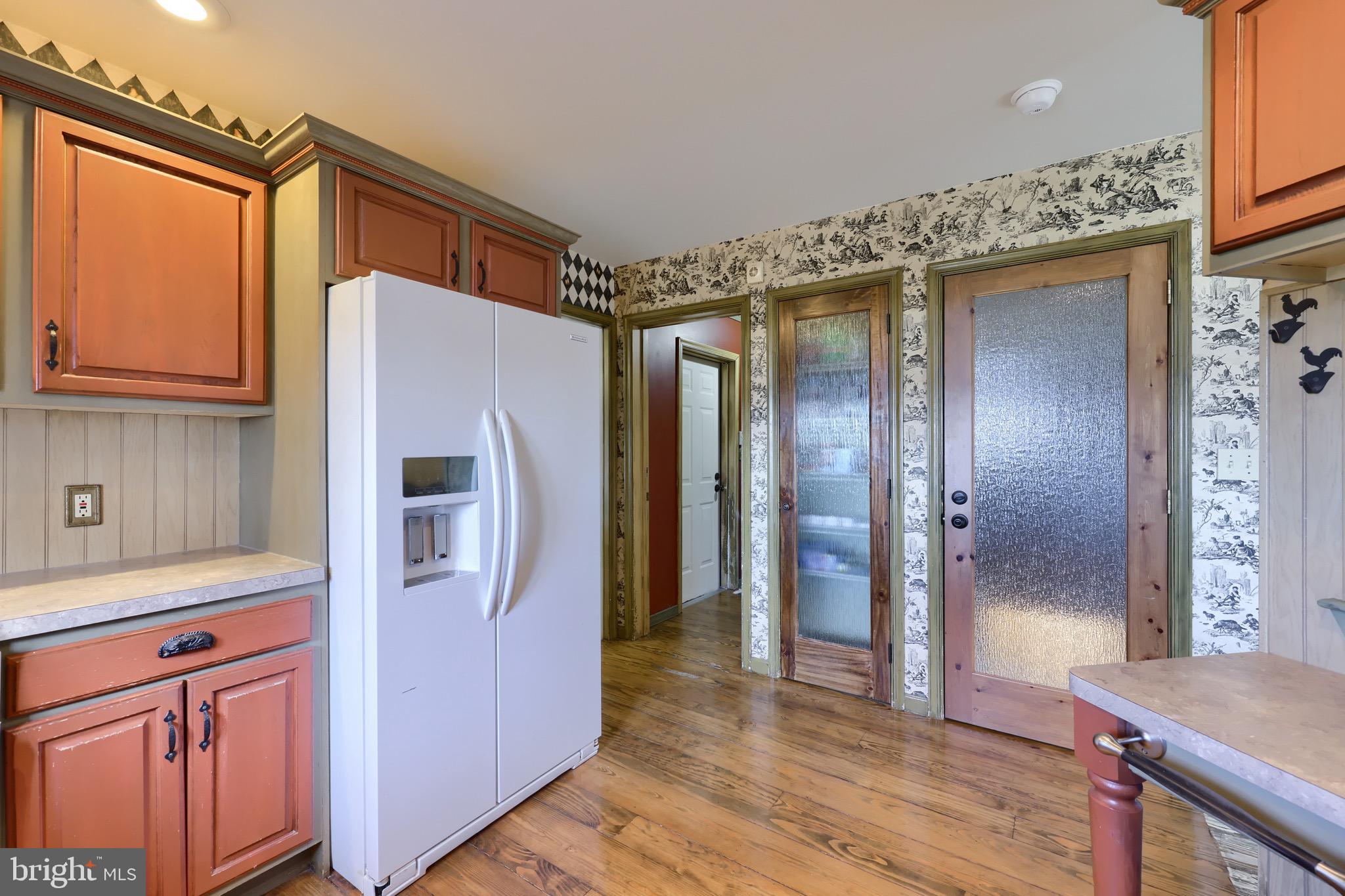 65 South Reamstown Road Stevens, PA 17578 - Photo 19 of 55 a kitchen with stainless steel appliances granite countertop a refrigerator and a stove top oven