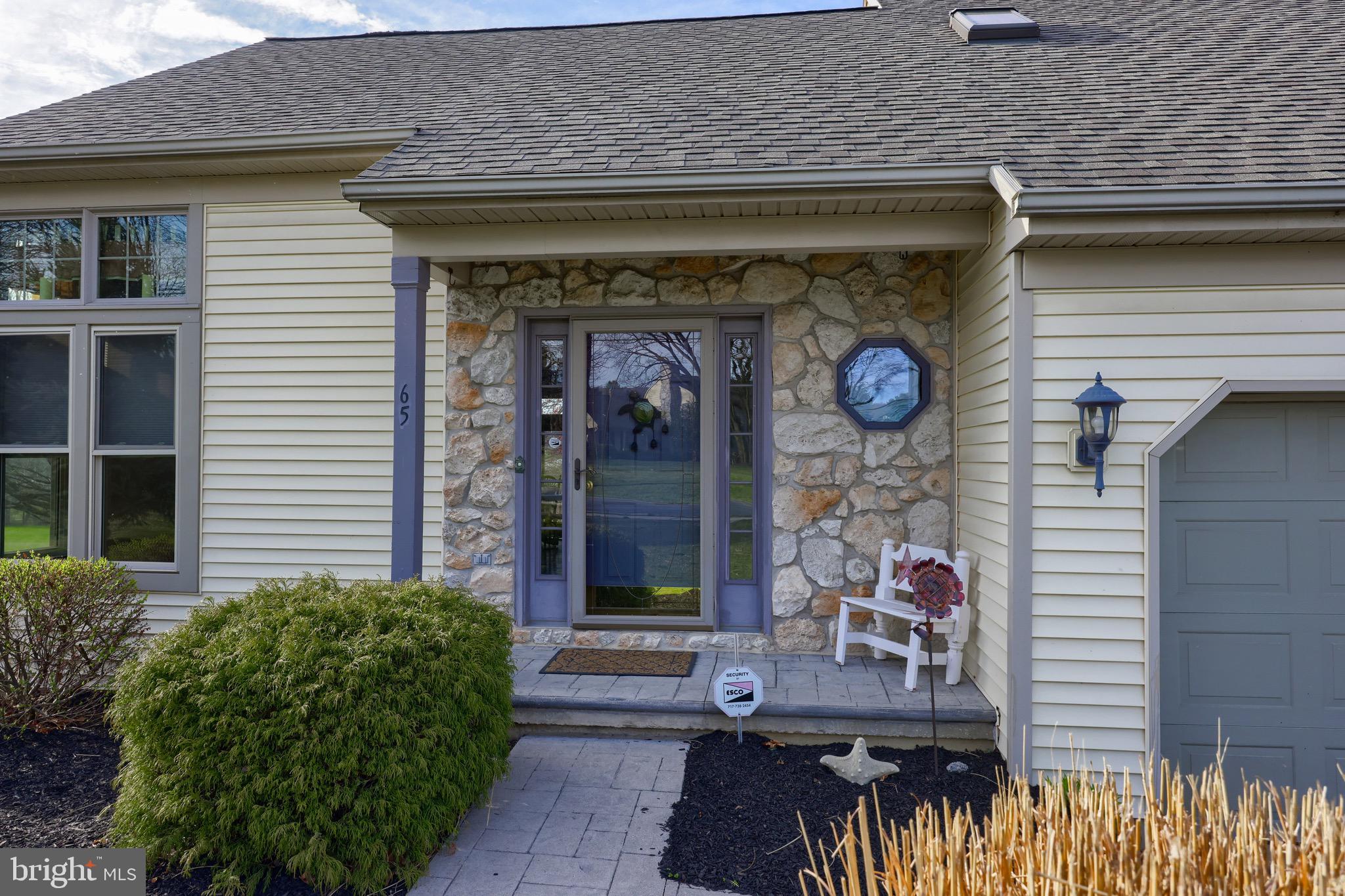 65 South Reamstown Road Stevens, PA 17578 - Photo 4 of 55 a front view of a house with outdoor seating and plants