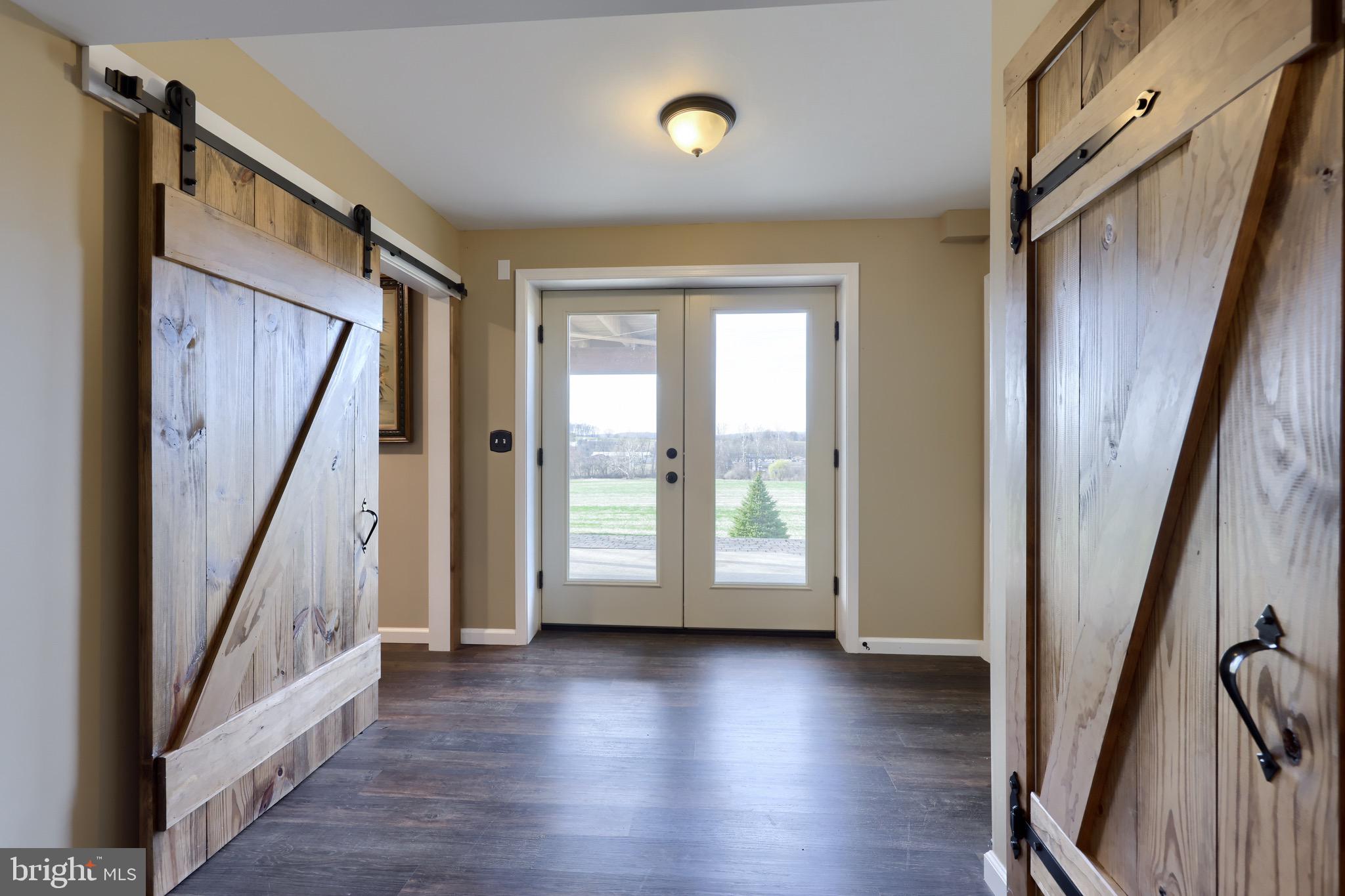 65 South Reamstown Road Stevens, PA 17578 - Photo 43 of 55 an empty room with wooden floor and windows