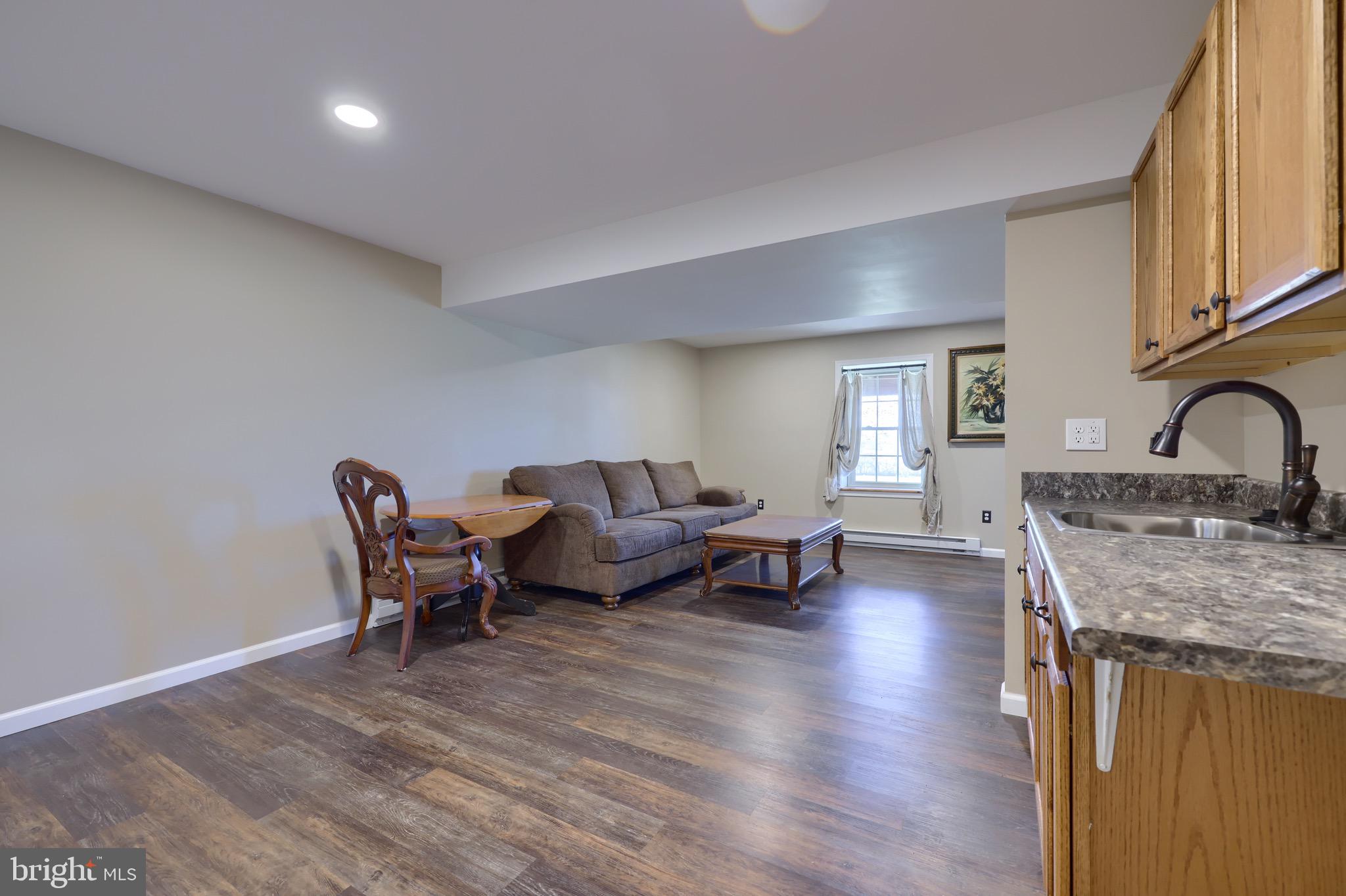 65 South Reamstown Road Stevens, PA 17578 - Photo 45 of 55 a living room with furniture and a wooden floor