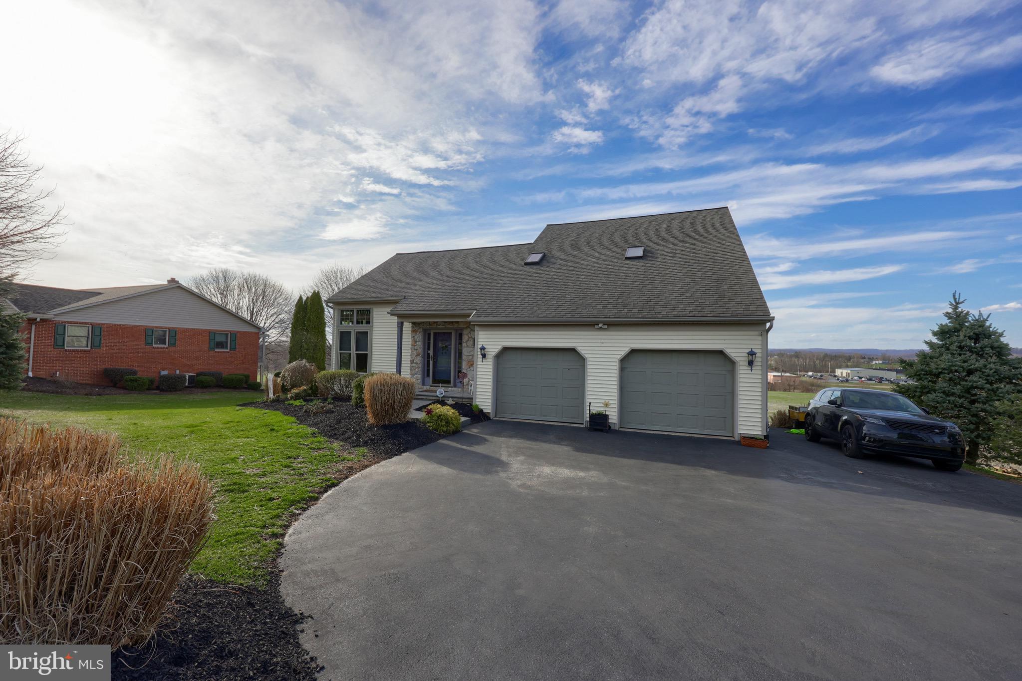 65 South Reamstown Road Stevens, PA 17578 - Photo 48 of 55 a front view of a house with a garden and pathway
