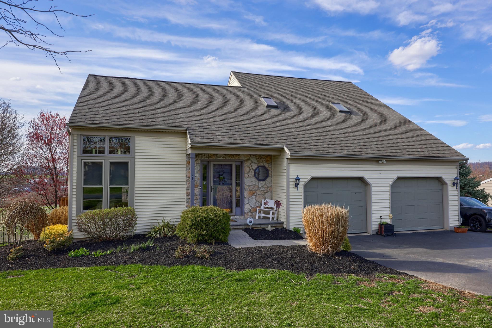 65 South Reamstown Road Stevens, PA 17578 - Photo 49 of 55 a front view of a house with a yard and garage