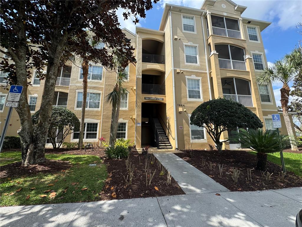 7664 Comrow Street, Unit 204 Kissimmee, FL 34747 - Photo 1 of 17 a front view of a building