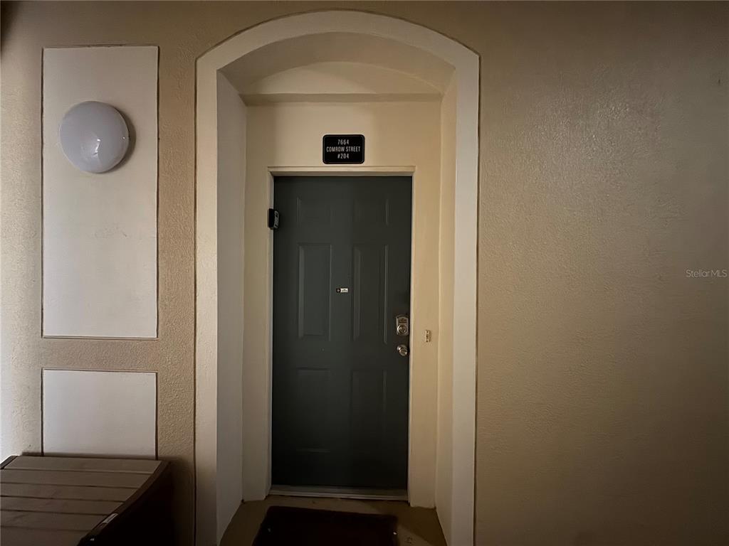 7664 Comrow Street, Unit 204 Kissimmee, FL 34747 - Photo 14 of 17 a view of hallway with wooden floor