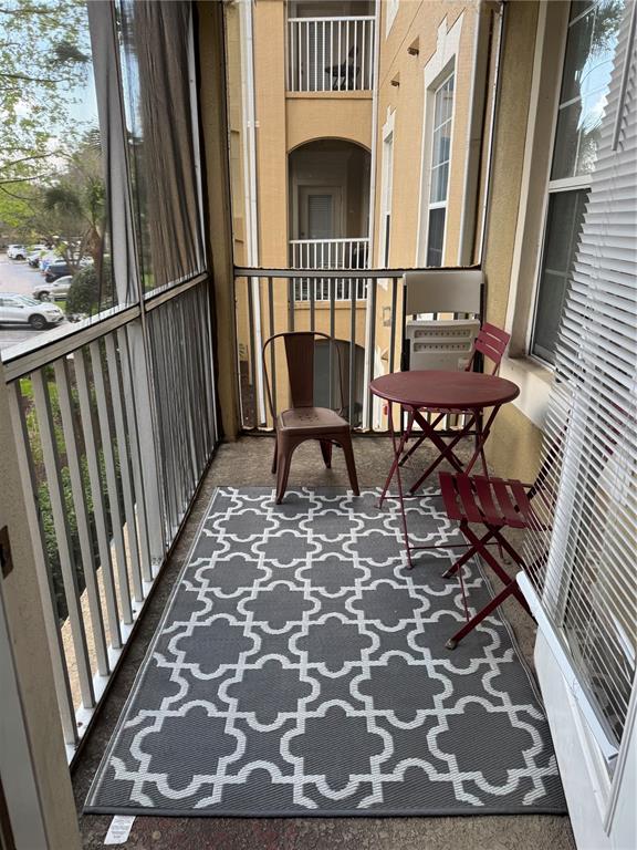 7664 Comrow Street, Unit 204 Kissimmee, FL 34747 - Photo 15 of 17 a view of a balcony with furniture