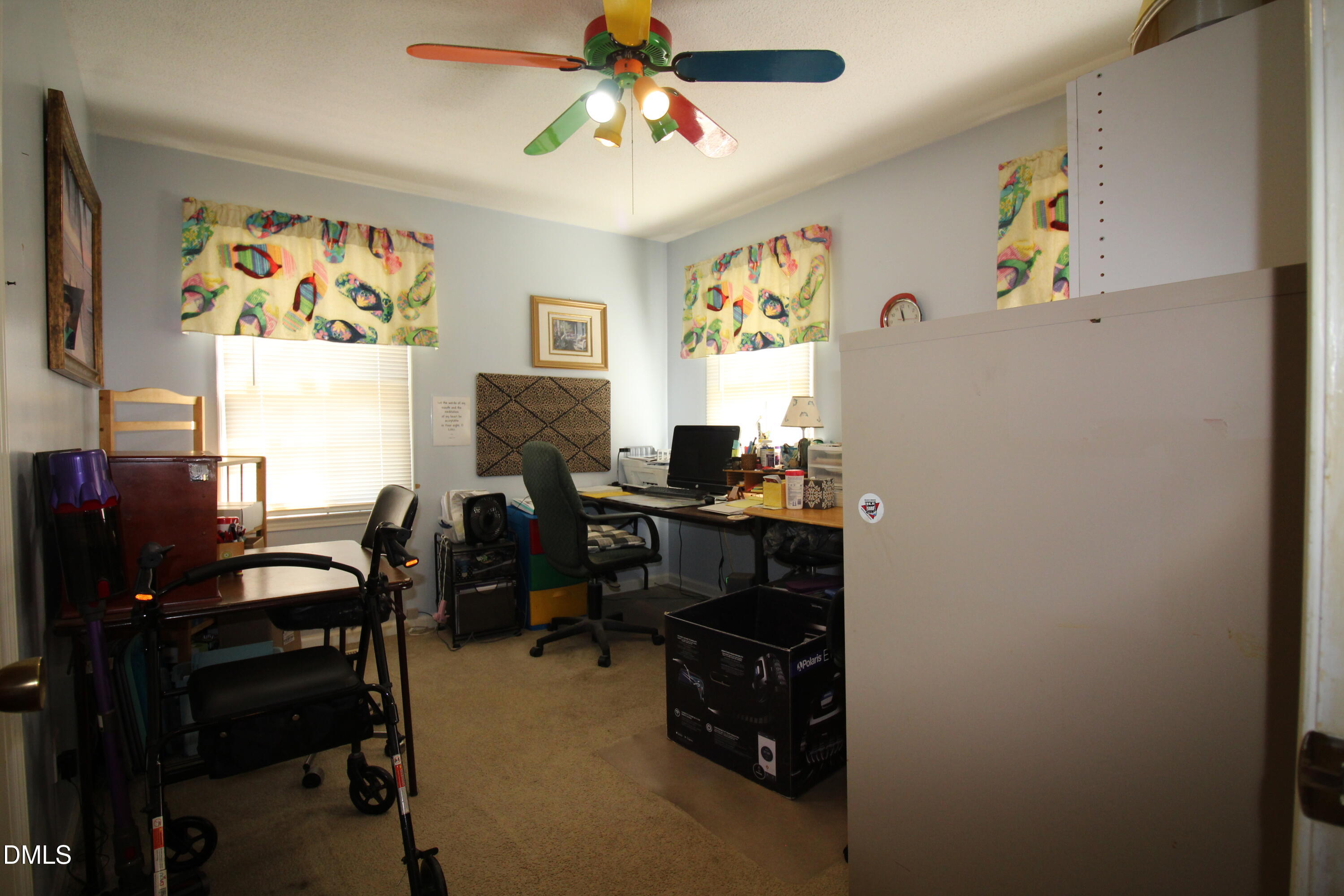 56 Ash Street Coats, NC 27521 - Photo 19 of 28 a view of a workspace with furniture and a window