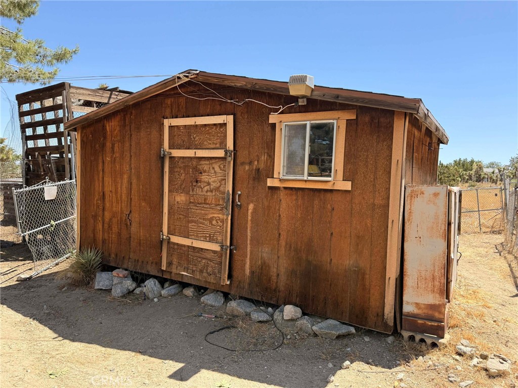 10623 Desert View Road Pinon Hills, CA 92372 - Photo 60 of 76 a front view of a house