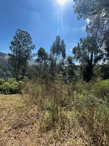 a view of a roof with street view and wooden floor