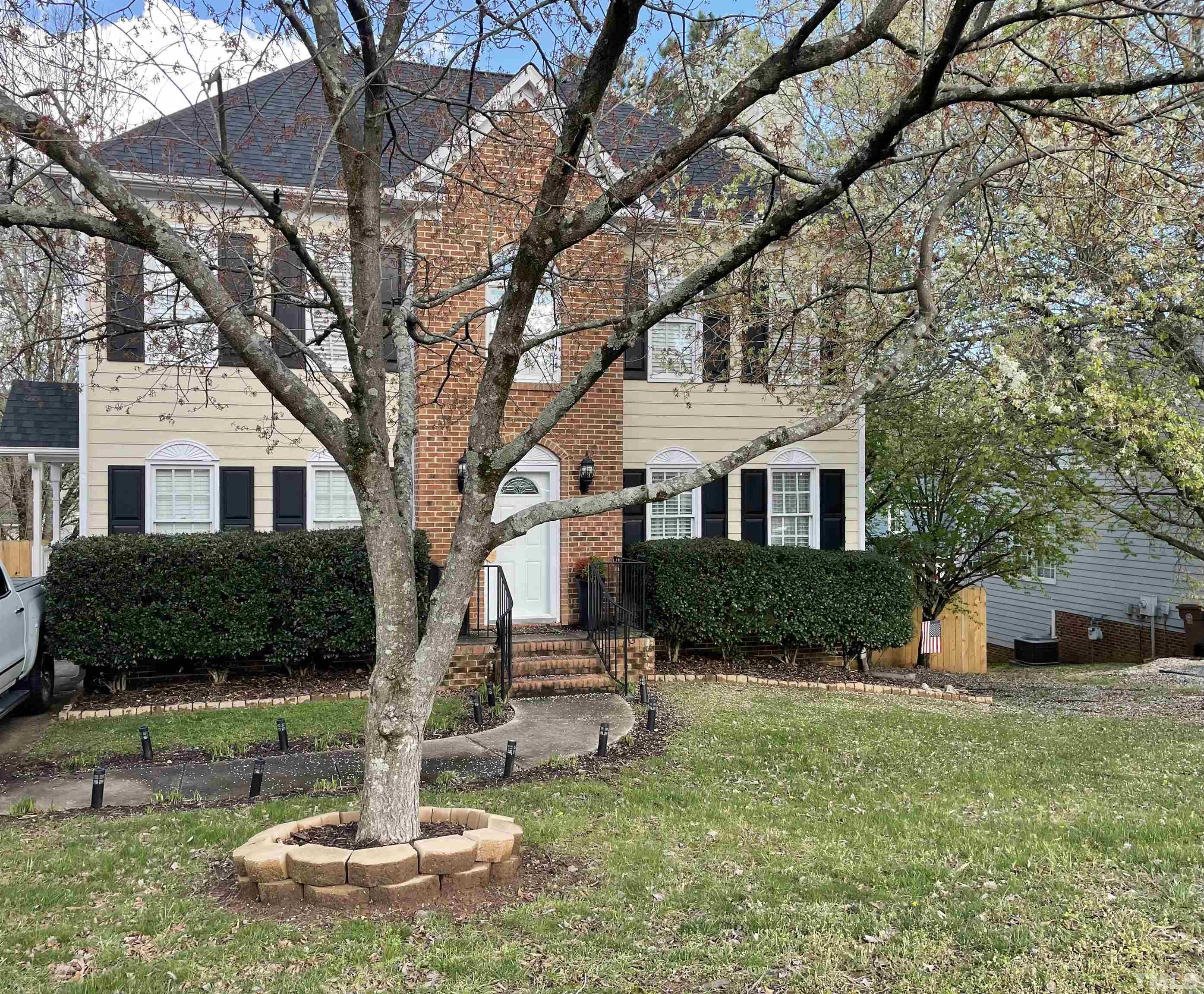 a front view of a house with a yard
