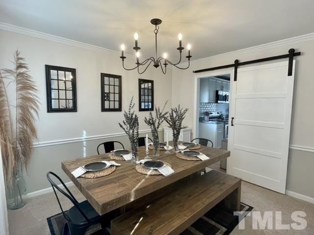 2908 Laura Duncan Road Cary, NC 27513 - Photo 7 of 8 a view of a dining room with furniture and chandelier