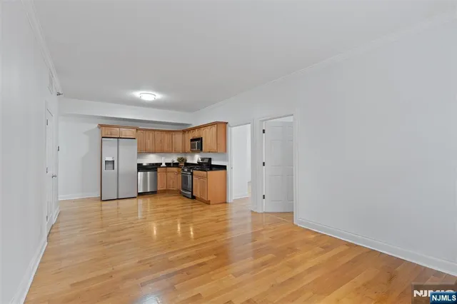 a view of kitchen with wooden floor