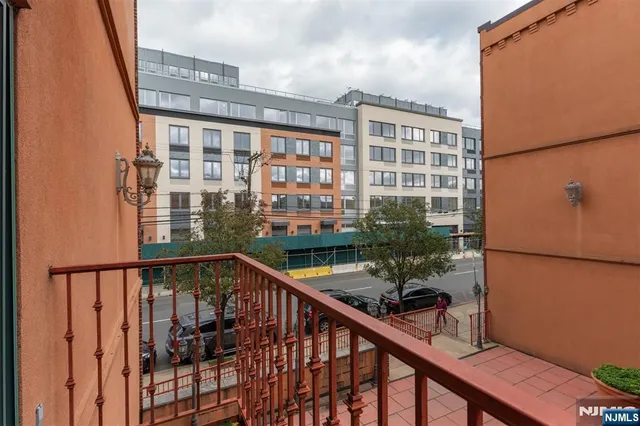 a view of balcony with a potted plant