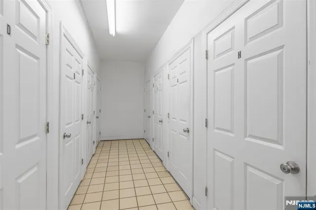 a view of a hallway with windows