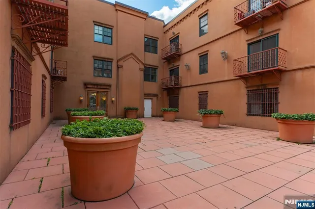 a view of a yard with potted plants