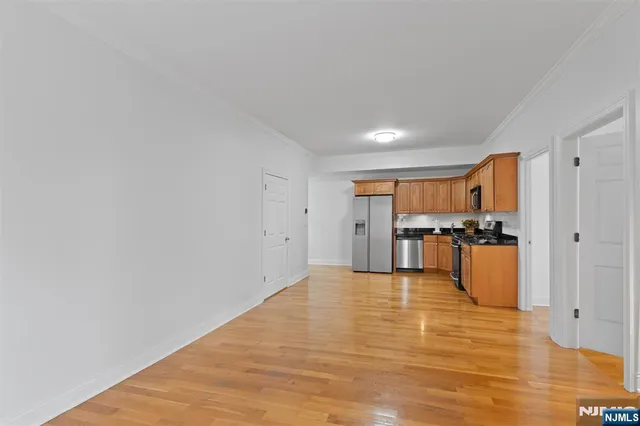 a view of kitchen with wooden floor