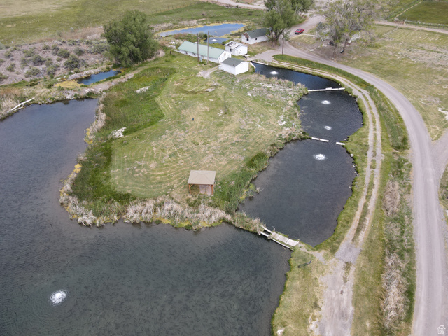202 North Westhaven Road Richfield, UT 84701 - Photo 4 of 10 Multiple ponds with integrated aerators, a small dock, and a waterside gazebo structure