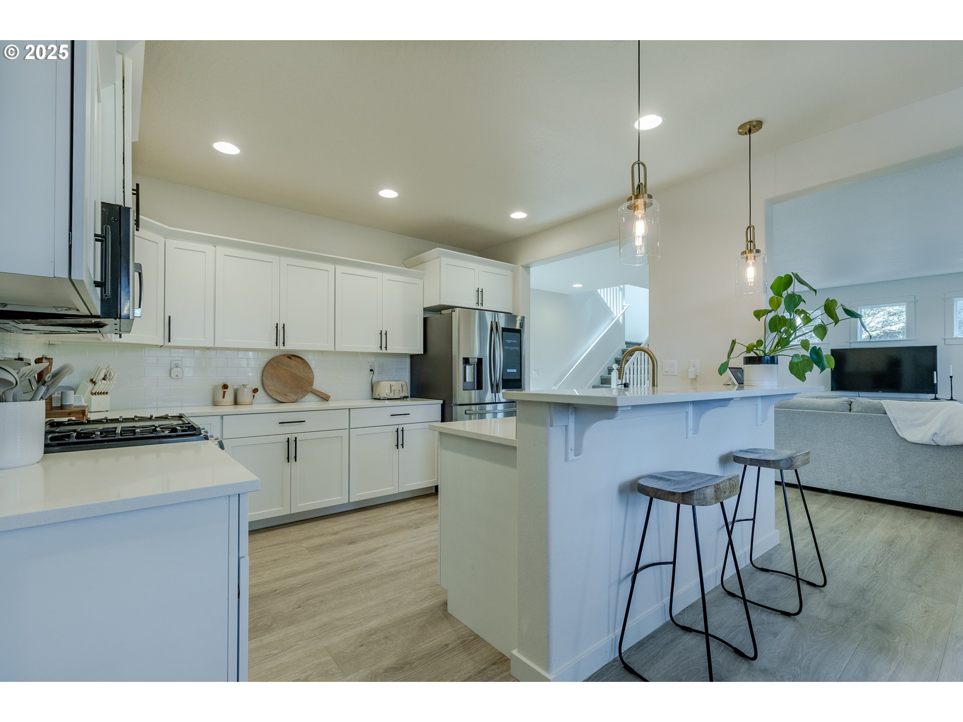 782 South 52nd Street Springfield, OR 97478 - Photo 15 of 41 a kitchen with kitchen island granite countertop a sink cabinets and stainless steel appliances