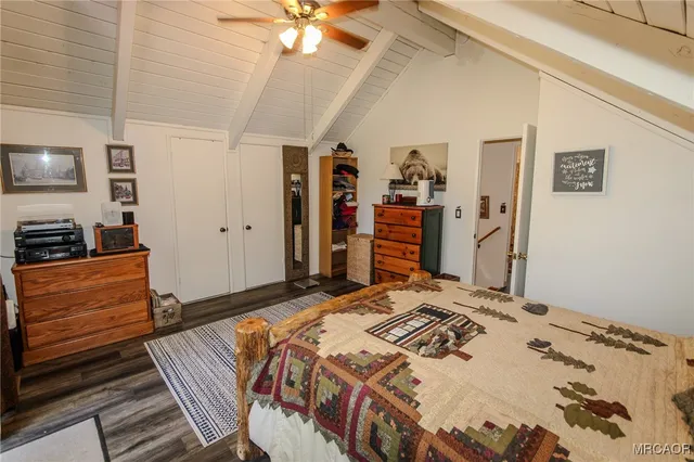 a bathroom with a sink mirror vanity and toilet