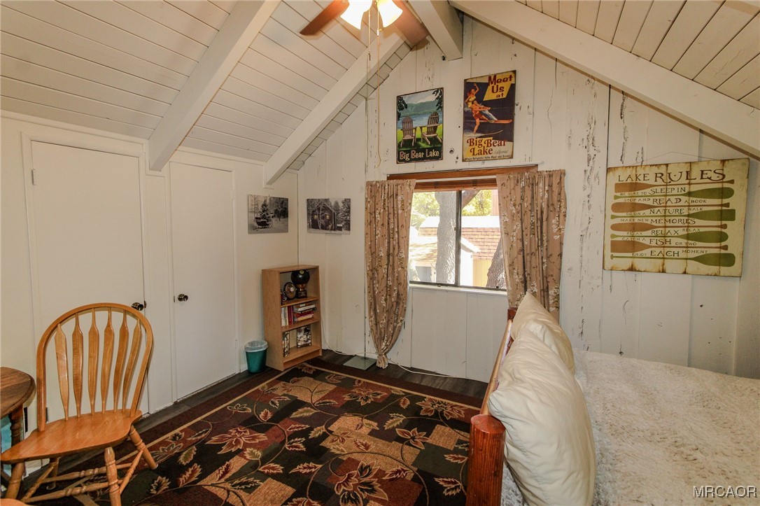 699 Santa Barbara Avenue Sugarloaf, CA 92386 - Photo 23 of 35 a bedroom with a bed and wooden floor