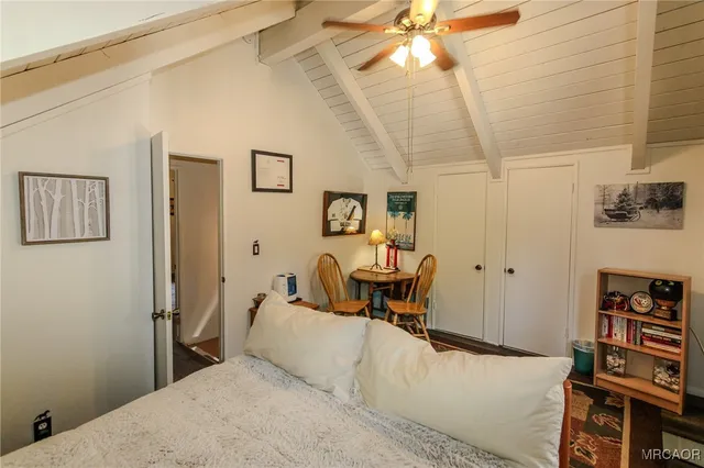 a bedroom with furniture and a window