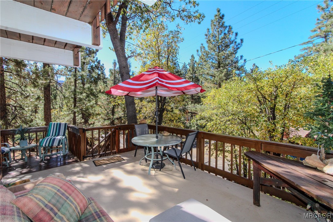 699 Santa Barbara Avenue Sugarloaf, CA 92386 - Photo 31 of 35 an outdoor space with patio and umbrella