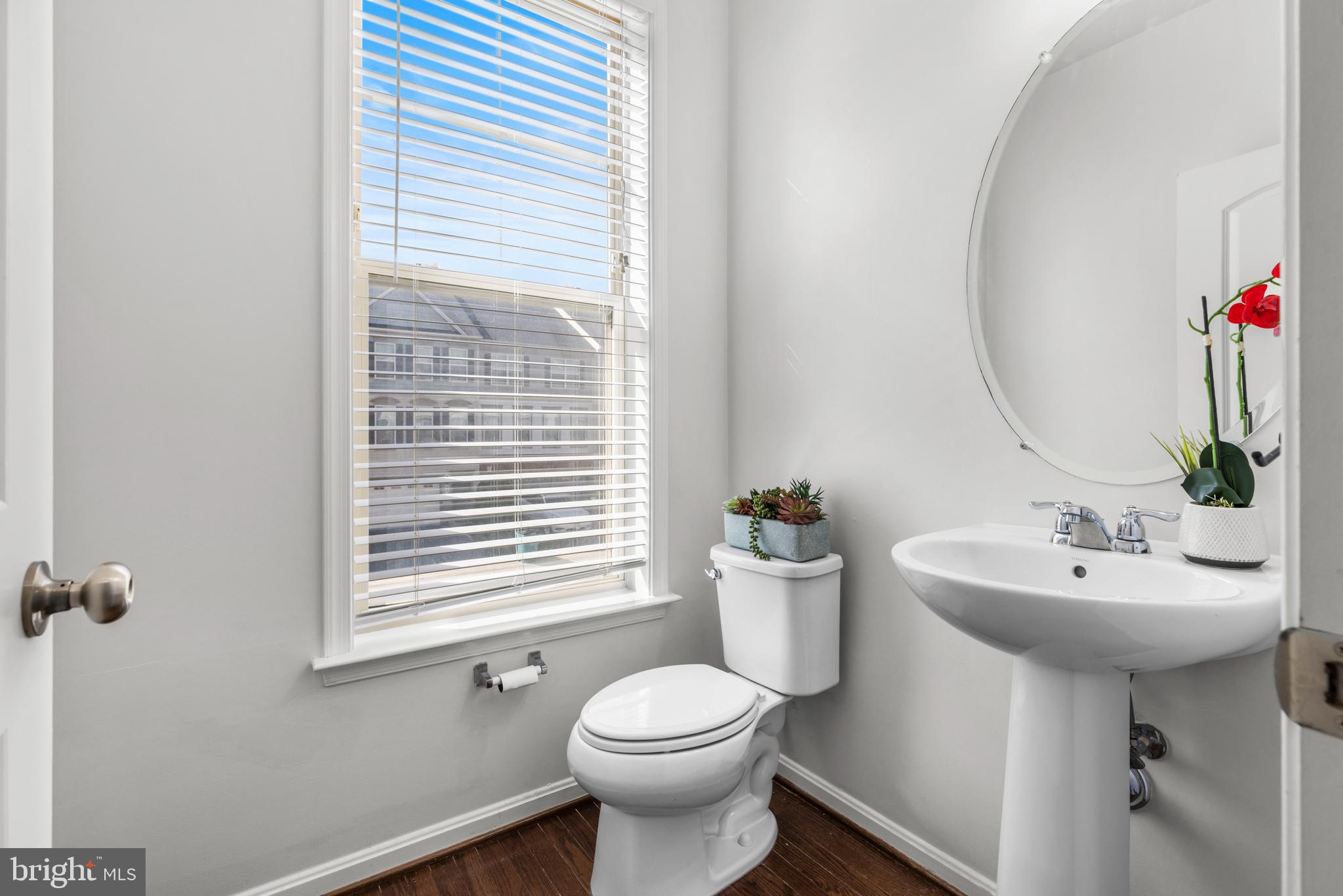 6552 Britannic Place Frederick, MD 21703 - Photo 13 of 34 a bathroom with a sink toilet and a mirror