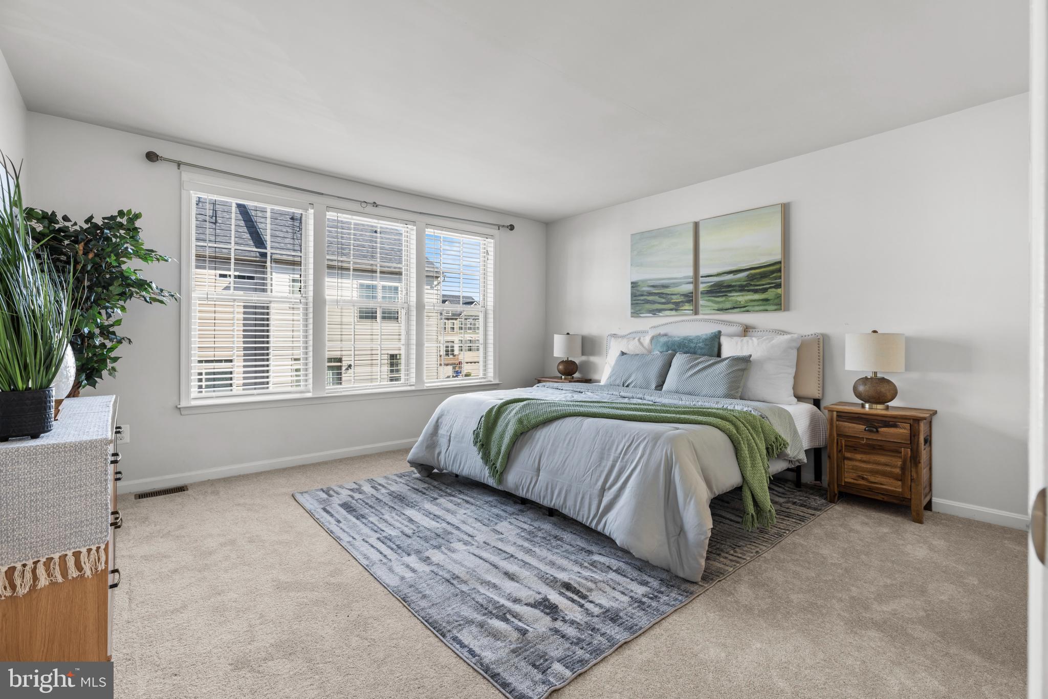 6552 Britannic Place Frederick, MD 21703 - Photo 16 of 34 a bedroom with bed and a large window