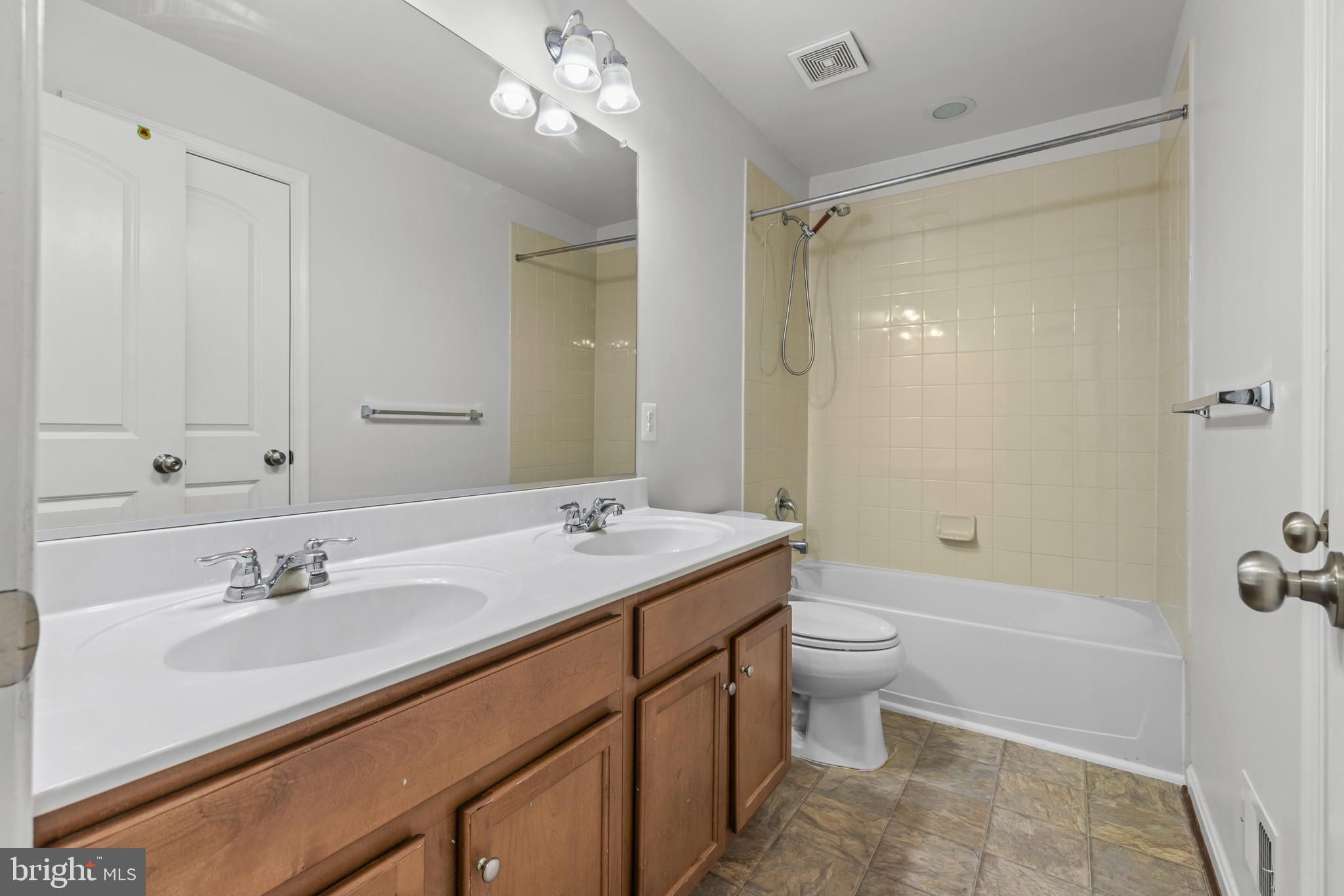 6552 Britannic Place Frederick, MD 21703 - Photo 23 of 34 a bathroom with a sink a toilet a shower and a mirror