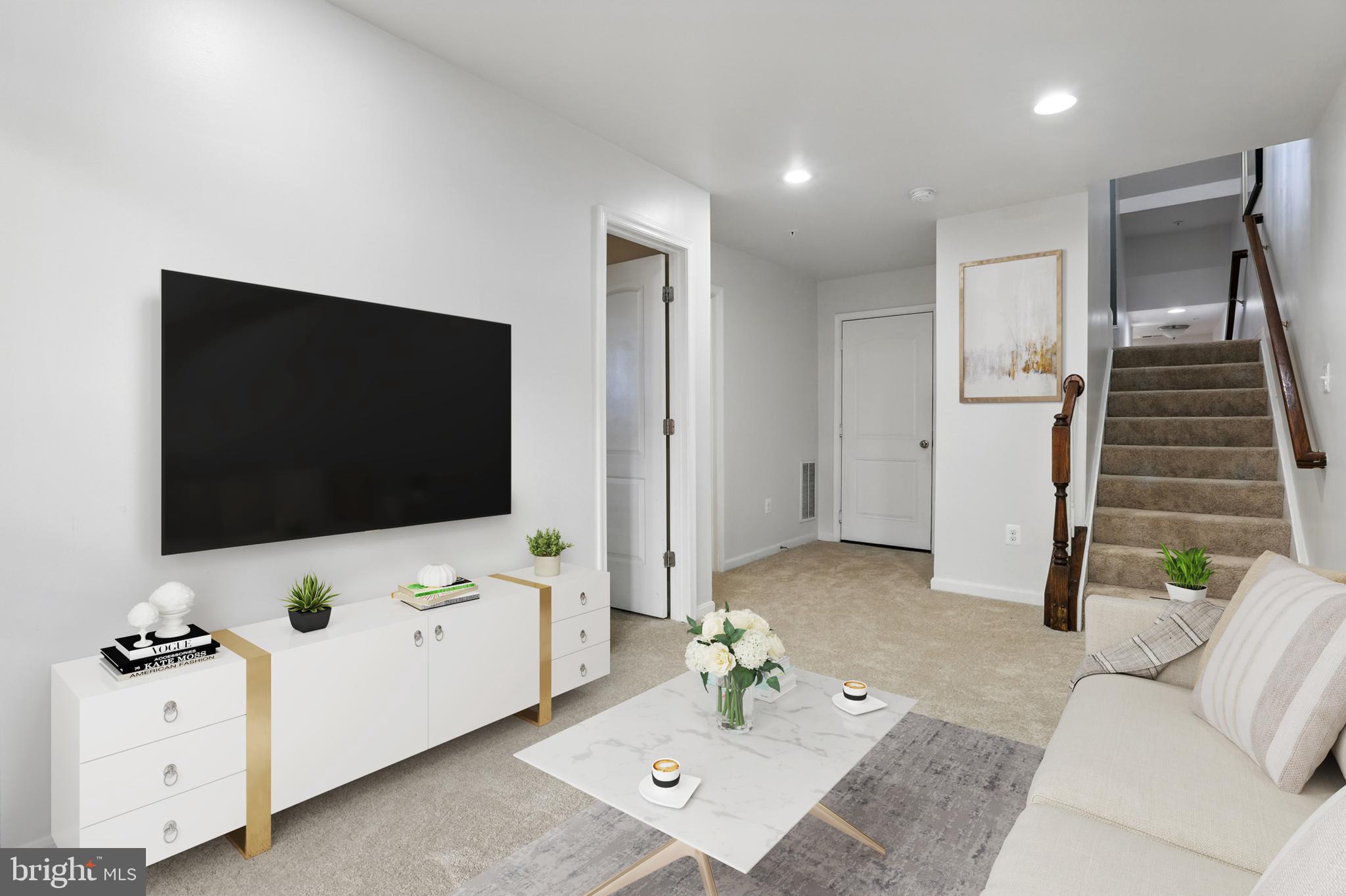 6552 Britannic Place Frederick, MD 21703 - Photo 27 of 34 a living room with furniture and a flat screen tv