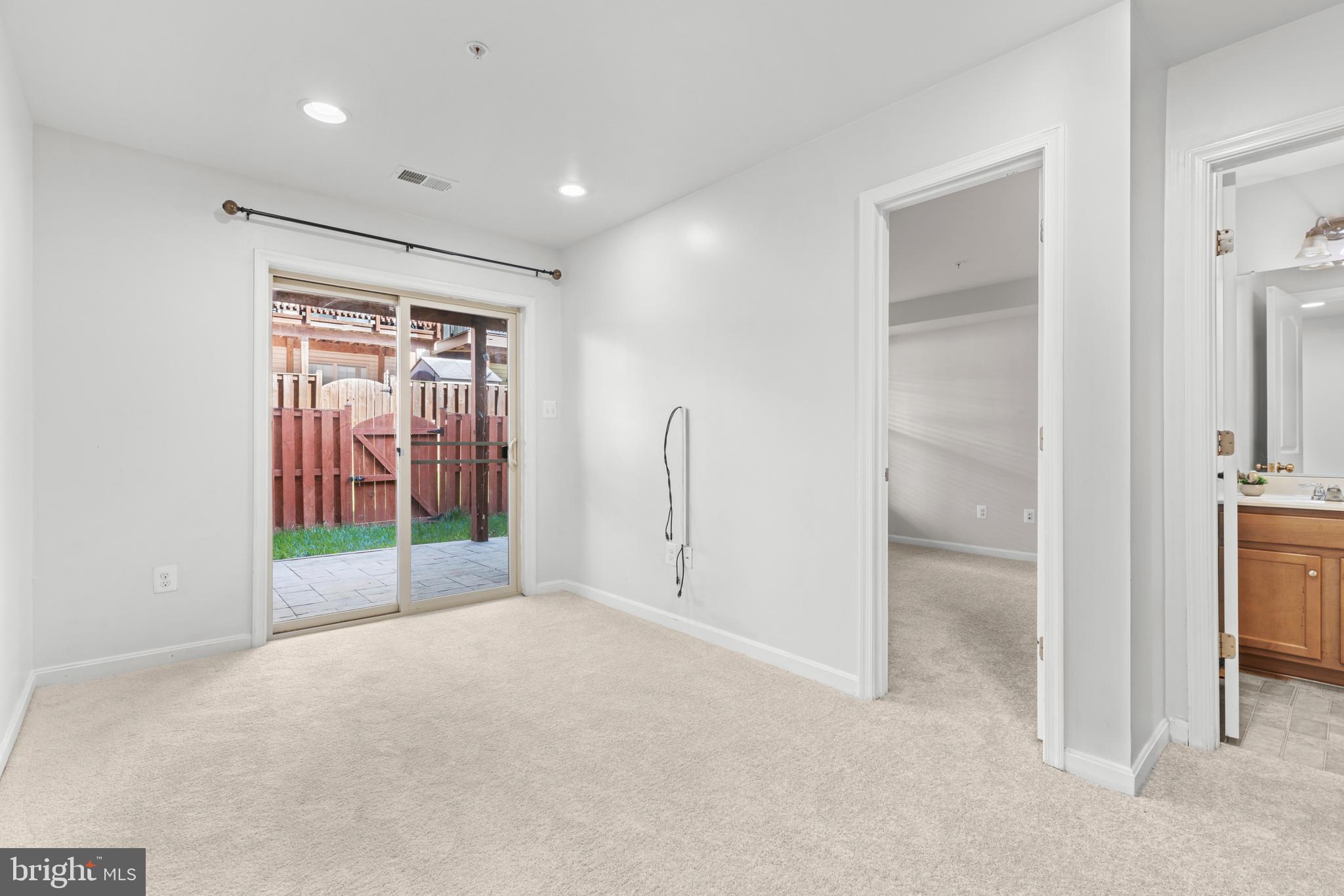 6552 Britannic Place Frederick, MD 21703 - Photo 30 of 34 a view of empty room with floor to ceiling window