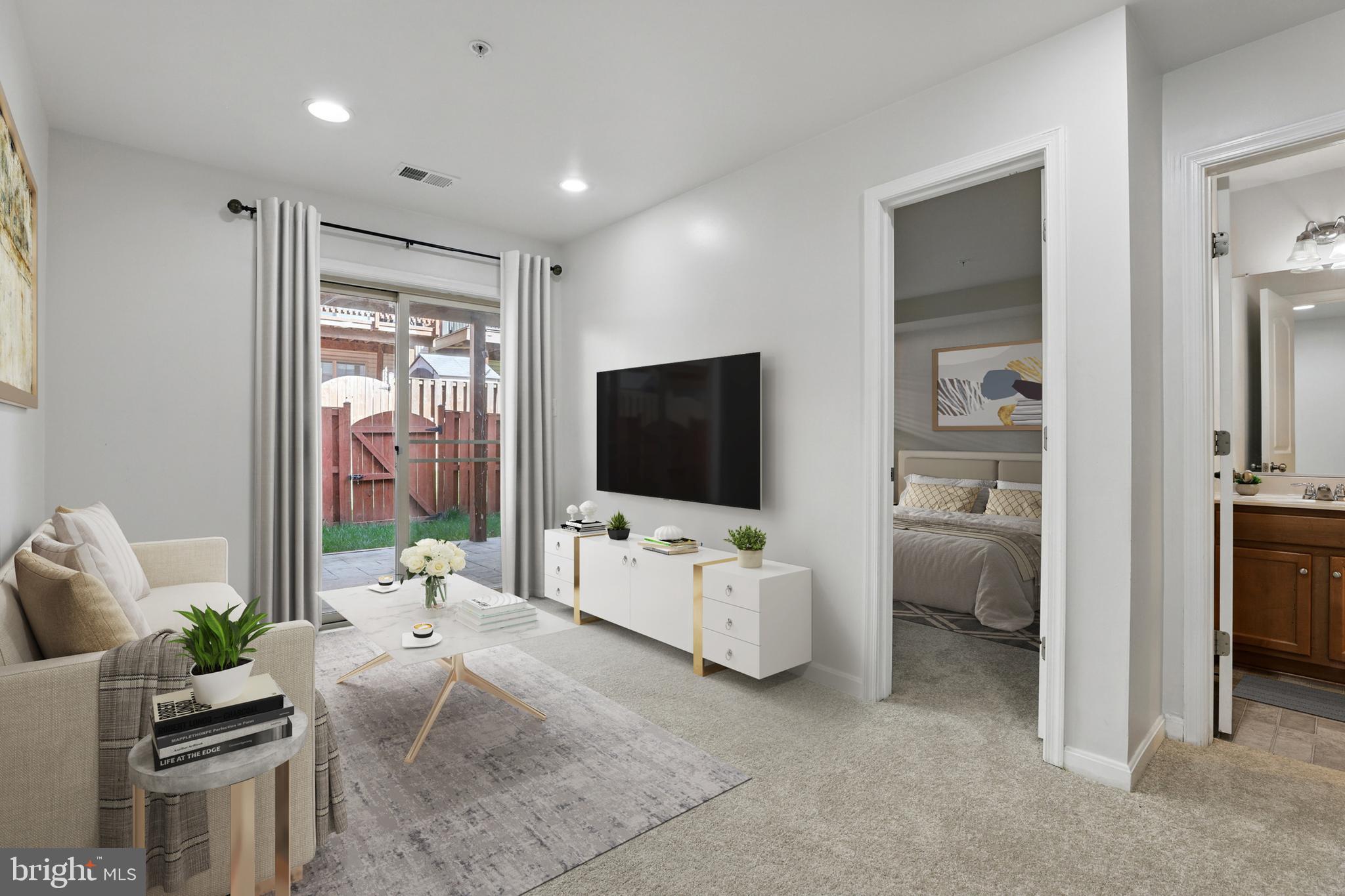 6552 Britannic Place Frederick, MD 21703 - Photo 31 of 34 a living room with furniture and a flat screen tv