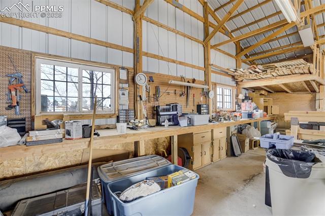 5455 Prospero Road Peyton, CO 80831 - Photo 42 of 47 Oversized garage offers plenty of room for 5-6 cars or keep the workbench area