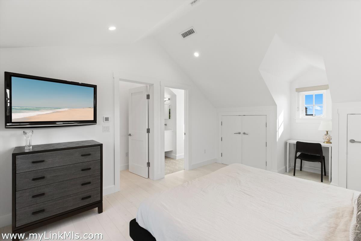 3 Tautemo Way Nantucket, MA 02554 - Photo 51 of 57 a bedroom with a bed and a flat tv screen in it
