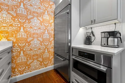 a kitchen with a stove and a microwave