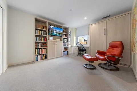 a room with furniture and gym equipment
