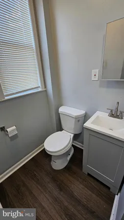 a bathroom with a toilet and a sink