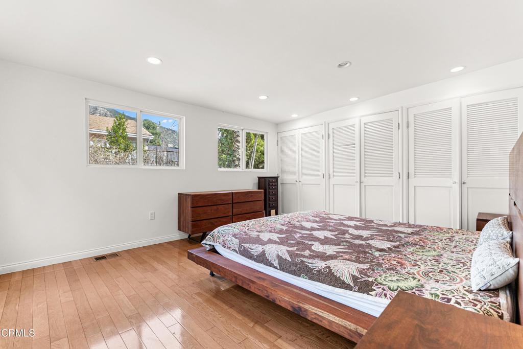 3323 Reta Street La Crescenta, CA 91214 - Photo 17 of 18 a bedroom with a bed and wooden floor