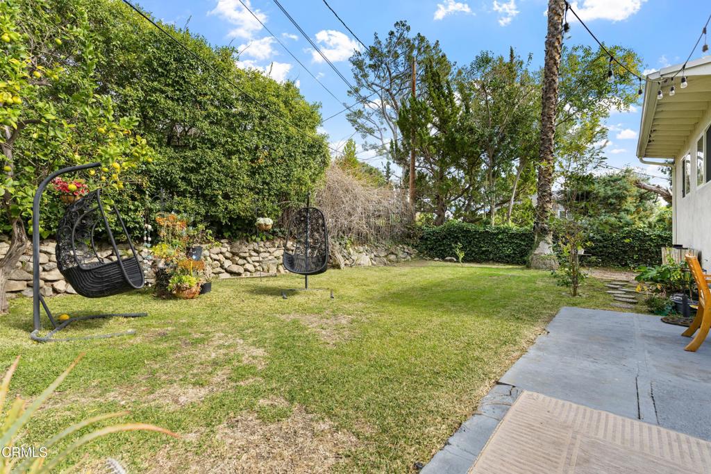 3323 Reta Street La Crescenta, CA 91214 - Photo 2 of 18 a view of a garden with a bench