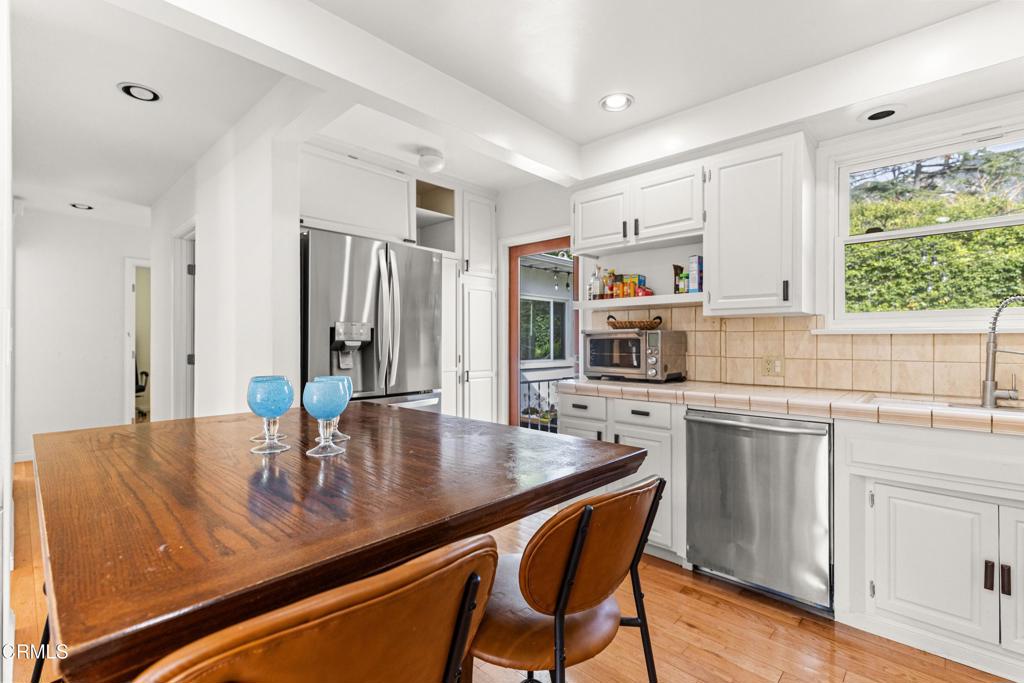 3323 Reta Street La Crescenta, CA 91214 - Photo 10 of 18 a kitchen with stainless steel appliances granite countertop a stove refrigerator and cabinets