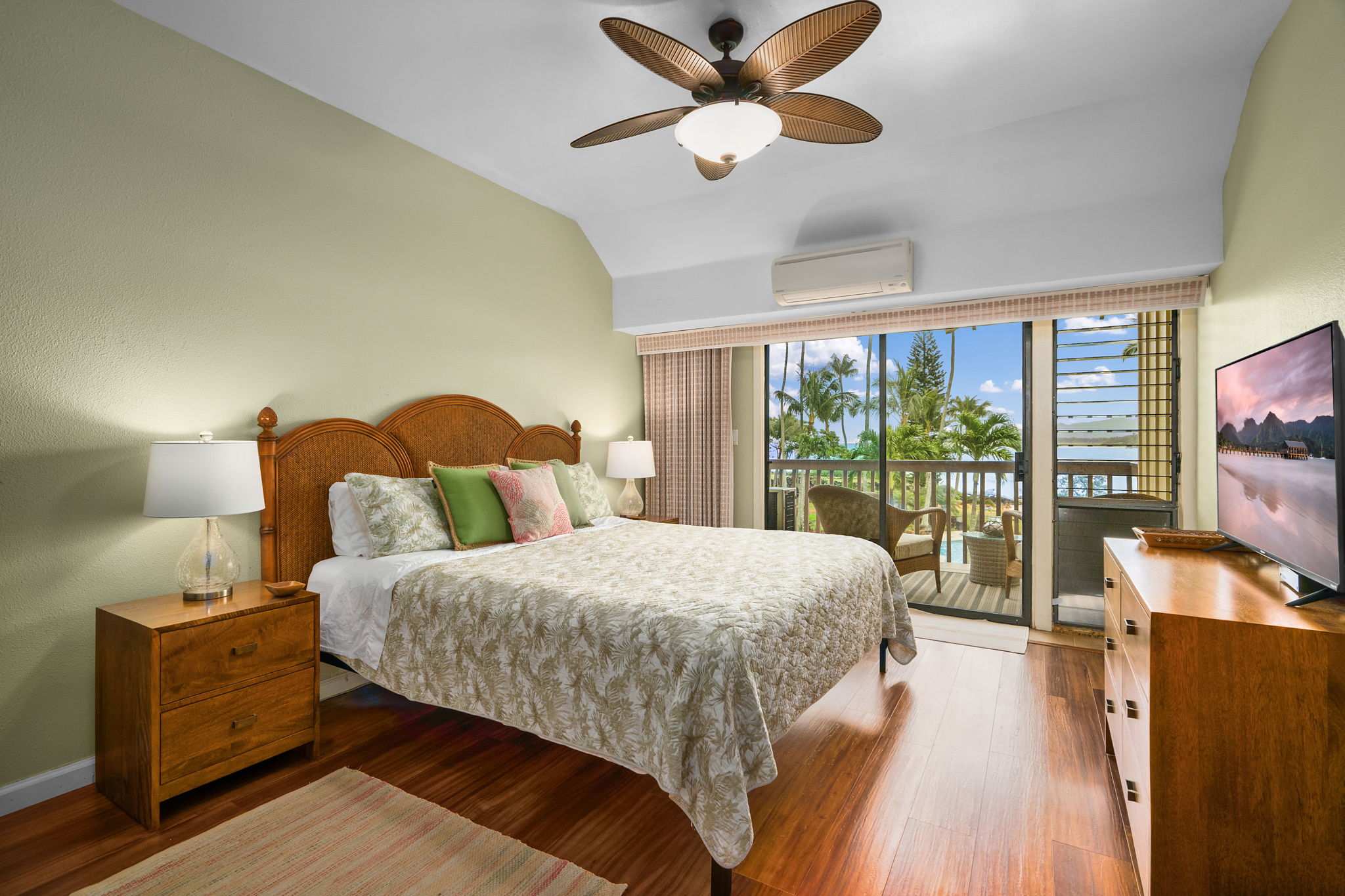410 Papaloa Road, Unit 233 Kapaa, HI 96746 - Photo 13 of 27 a bedroom with a bed and wooden floor