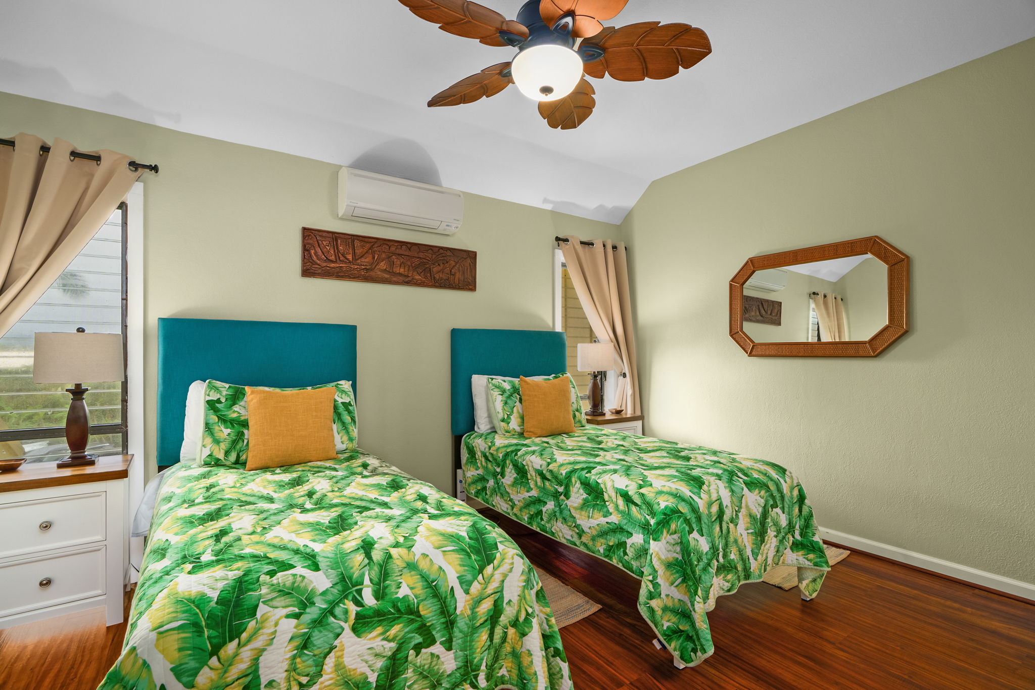 410 Papaloa Road, Unit 233 Kapaa, HI 96746 - Photo 18 of 27 a bedroom with a bed lamp and a large mirror