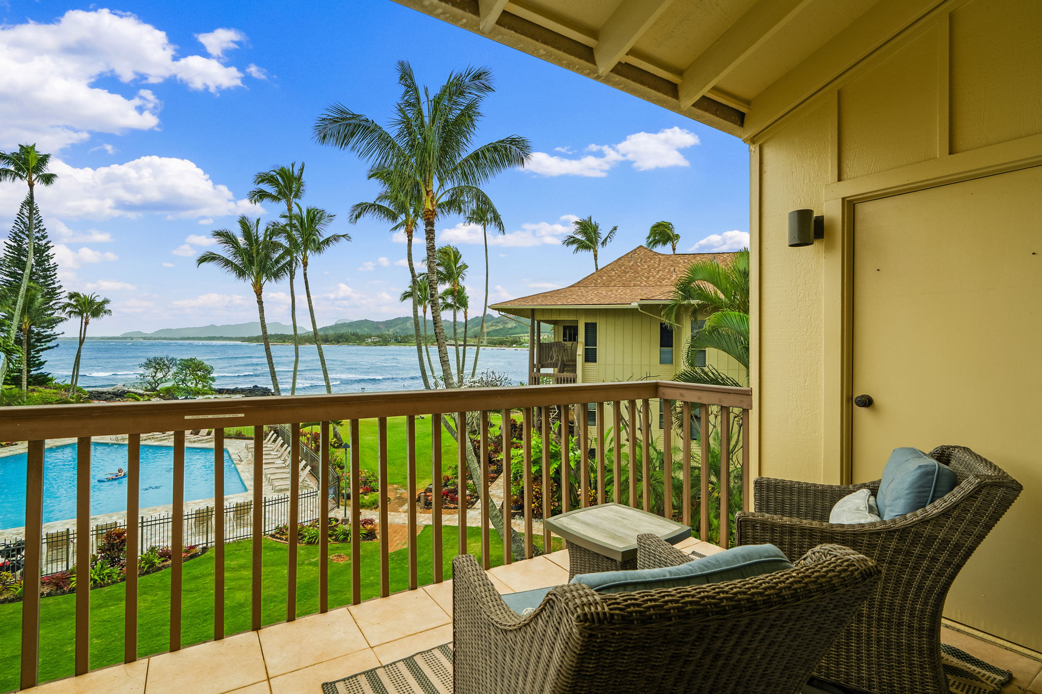 410 Papaloa Road, Unit 233 Kapaa, HI 96746 - Photo 3 of 27 a balcony with table and chairs