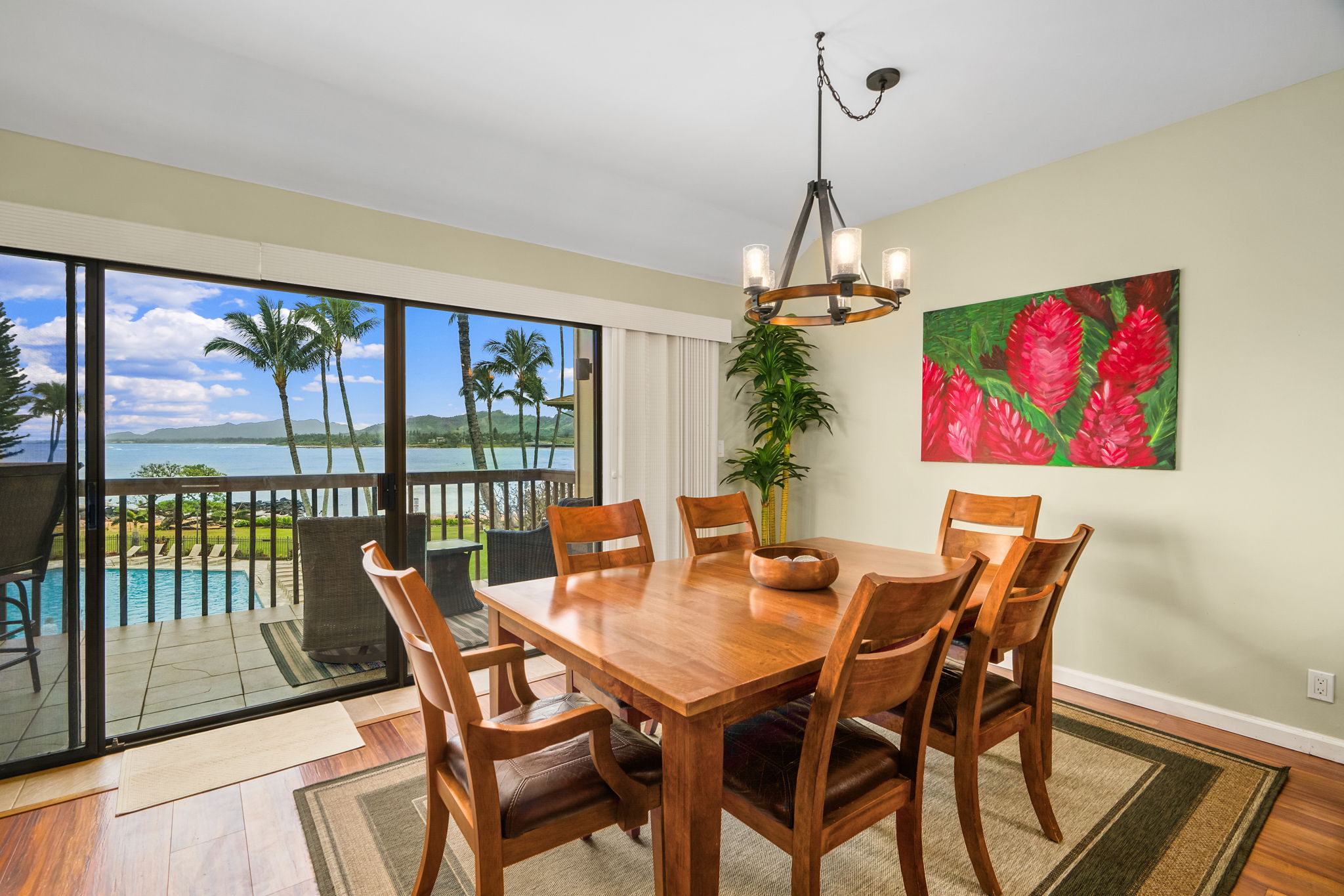 410 Papaloa Road, Unit 233 Kapaa, HI 96746 - Photo 5 of 27 a view of a dining room with furniture large windows and wooden floor