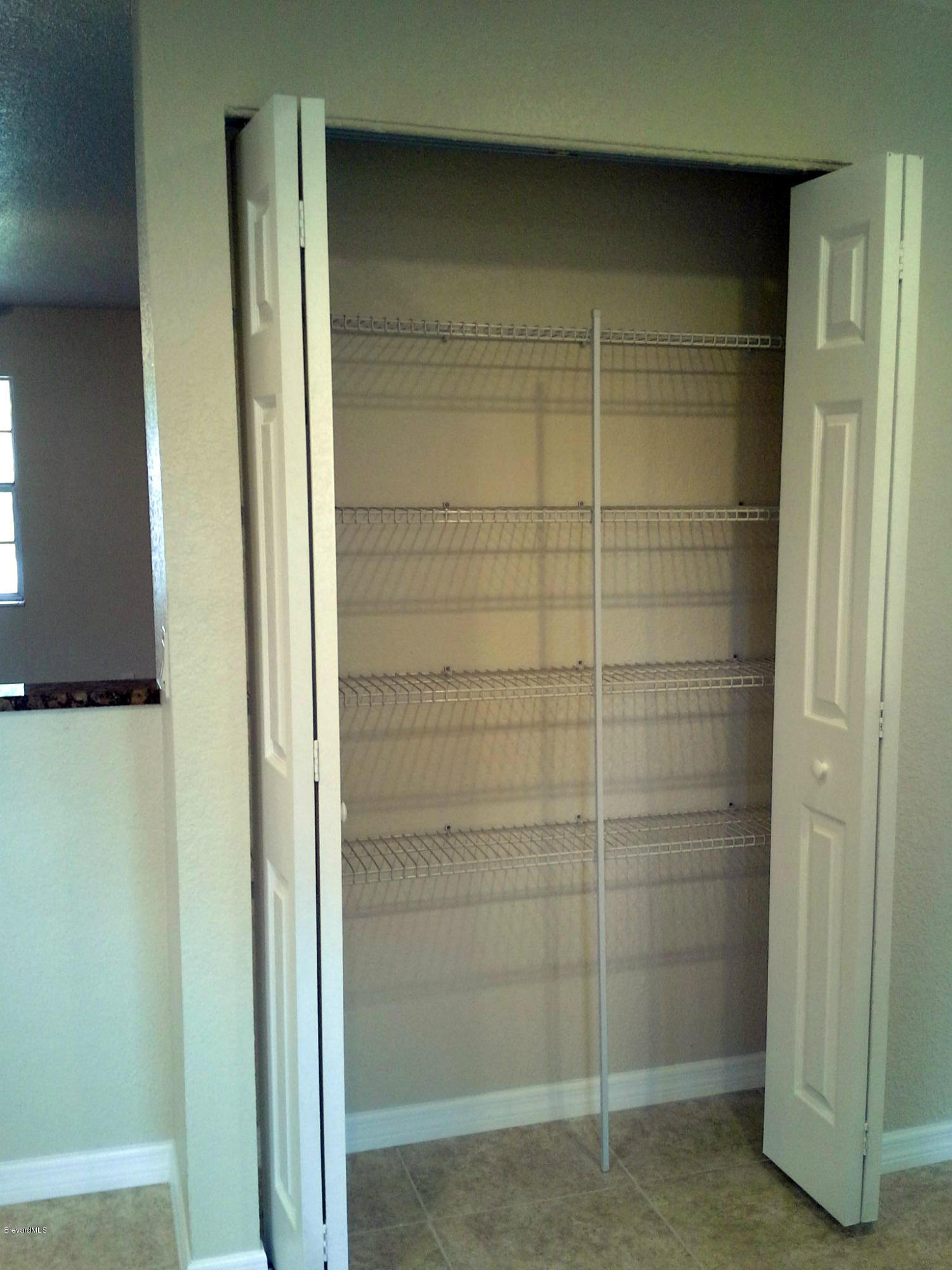 942 Kings Post Road Rockledge, FL 32955 - Photo 5 of 12 Kitchen Pantry